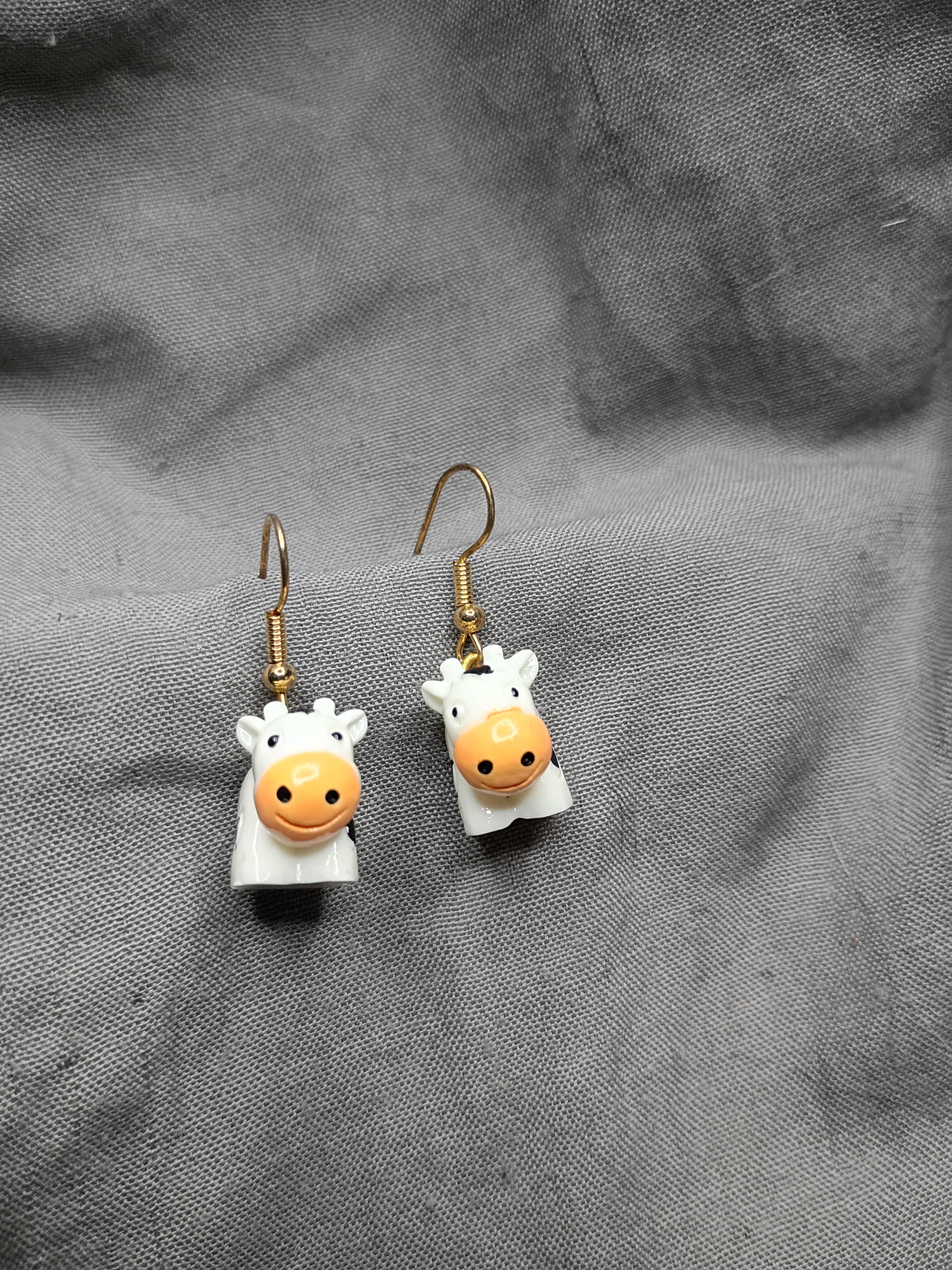 Tiny cow earrings